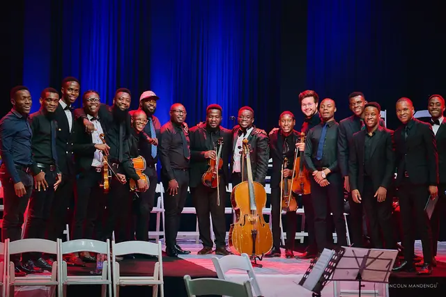 Tinashe Jera with the string players and band after the concert
